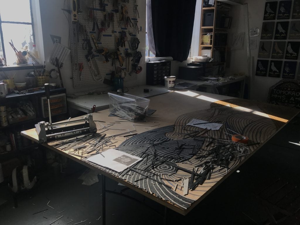 Currently working at Duke Riley’s Brooklyn Navy Yard studio.  Photo courtesy of the artist.