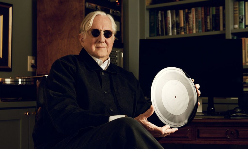 Producer Joseph Henry "T-Bone" Burnett with a NeoFidelity Ionic Original acetate disc of a 2021 Bob Dylan recording of "Blowin’ in the Wind." Photo by Jason Myers, courtesy of Christie's London. 