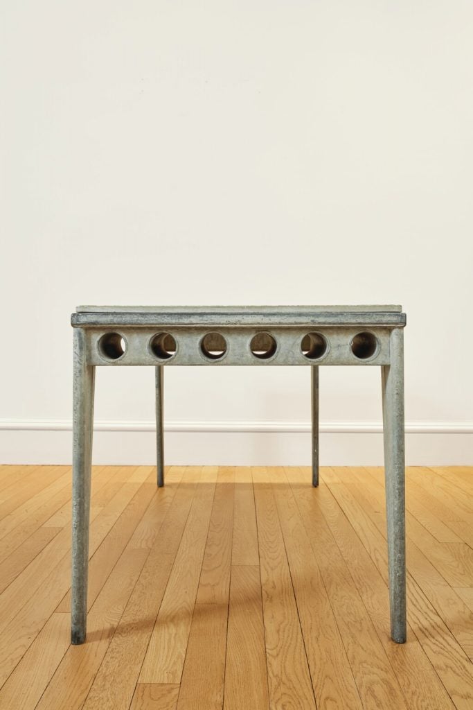 This Jean Prouvé refectory table has a "fibrated Granipoli concrete" top from the collection of Peter Brant and Stephanie Seymour sold for $988,000 at Sotheby's New York in December 2021. Granipoli is a trade term for an asbestos product. Photo courtesy of Sotheby's New York.