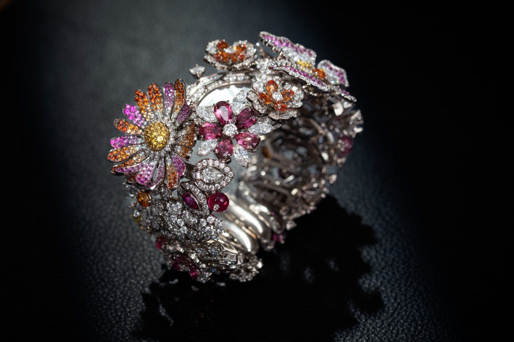 The Giardino Dell’Eden Piccolissimo watch is composed of 1,500 stones stones, featuring ruby, pink tourmalines, mandarin garnet, pink and yellow sapphires, and rock crystal. Courtesy of Bulgari.