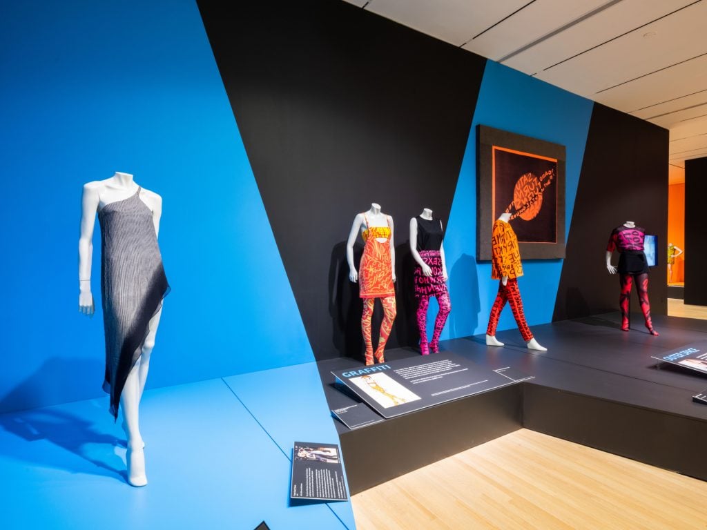 Installation view, "Stephen Sprouse: Rock |  Art |  Fashion" at the Indianapolis Museum of Art in Newfields.  Illustrations © Stephen Sprouse. 