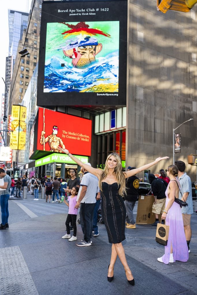 Heidi Klum attends Apefest during NFT NYC in Times Square on June 24, 2022 in New York City, with her new NFT art based on the Bored Ape Yacht Club displayed on a digital billboard. Photo by Gotham/GC Images.