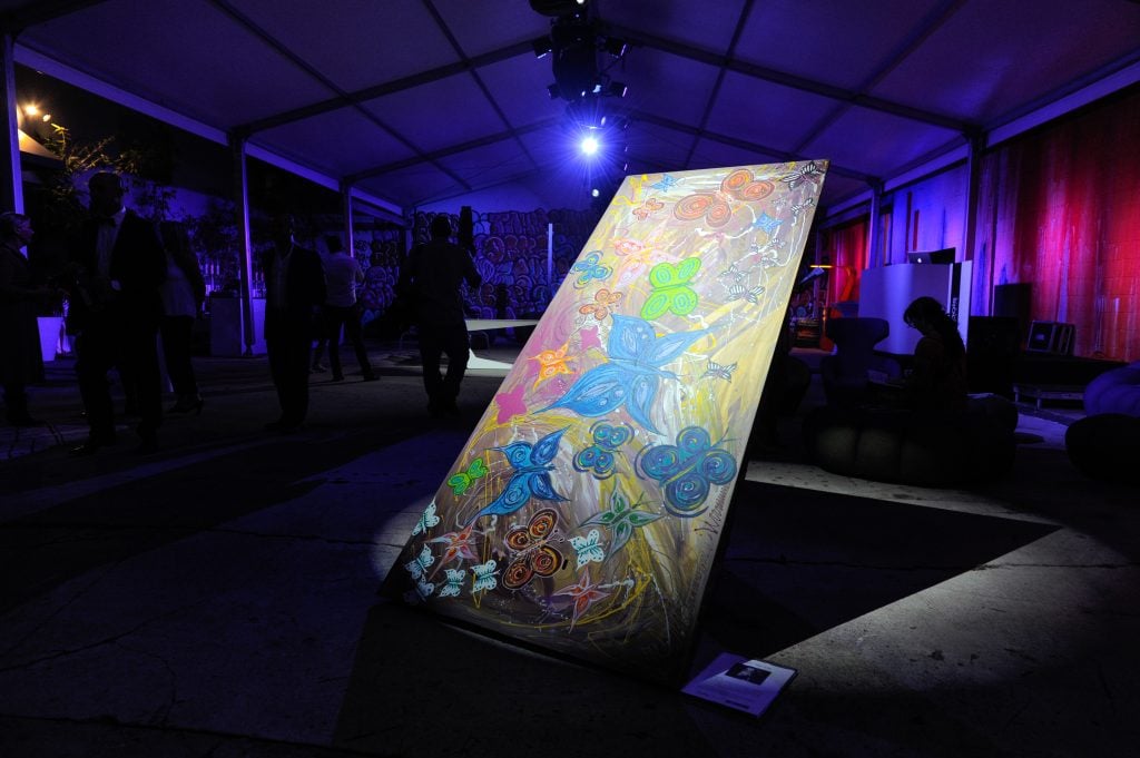 Heidi Klum painted this Roche Bobois desk for a charity sale during Art Basel Miami Beach in 2016. Photo by Sergi Alexander/Getty Images.