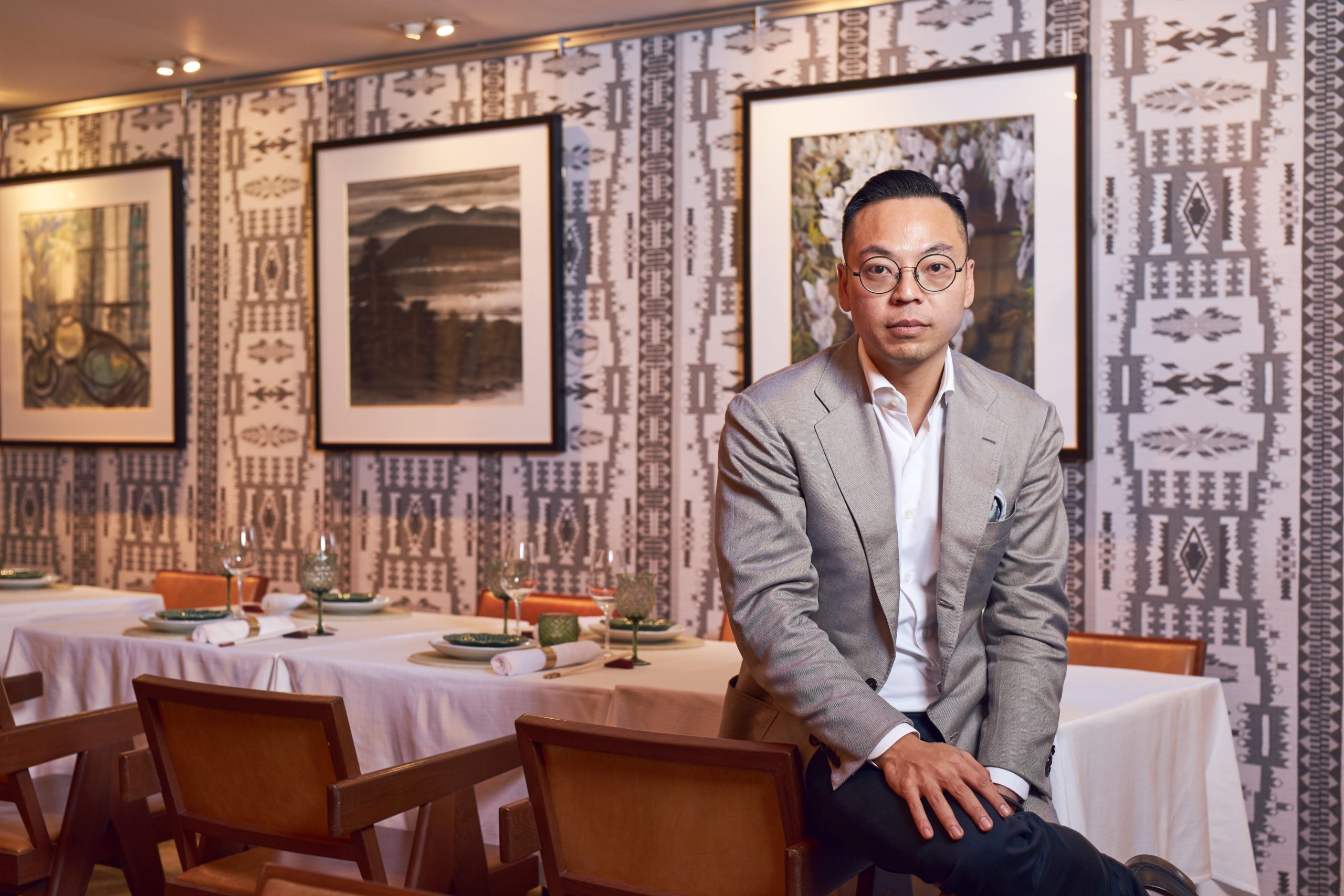 Alan Lo. Photographed here with Lin Fengmian's work. The artwork is part of the exhibition ‘A Taste of the Masters II’, co-curated by Catherine Maudsley.