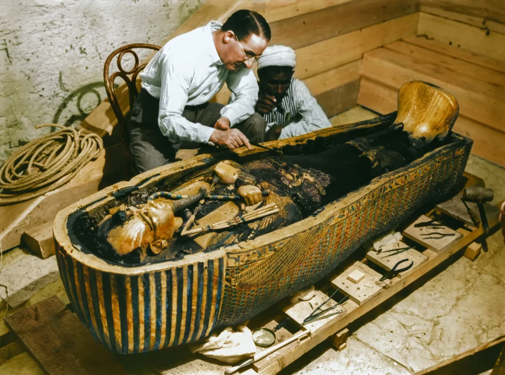 Harry Burton, Howard Carter examine King Tut's sarcophagus. Photo courtesy the Griffith Institute, colorization by Dynamichrome.