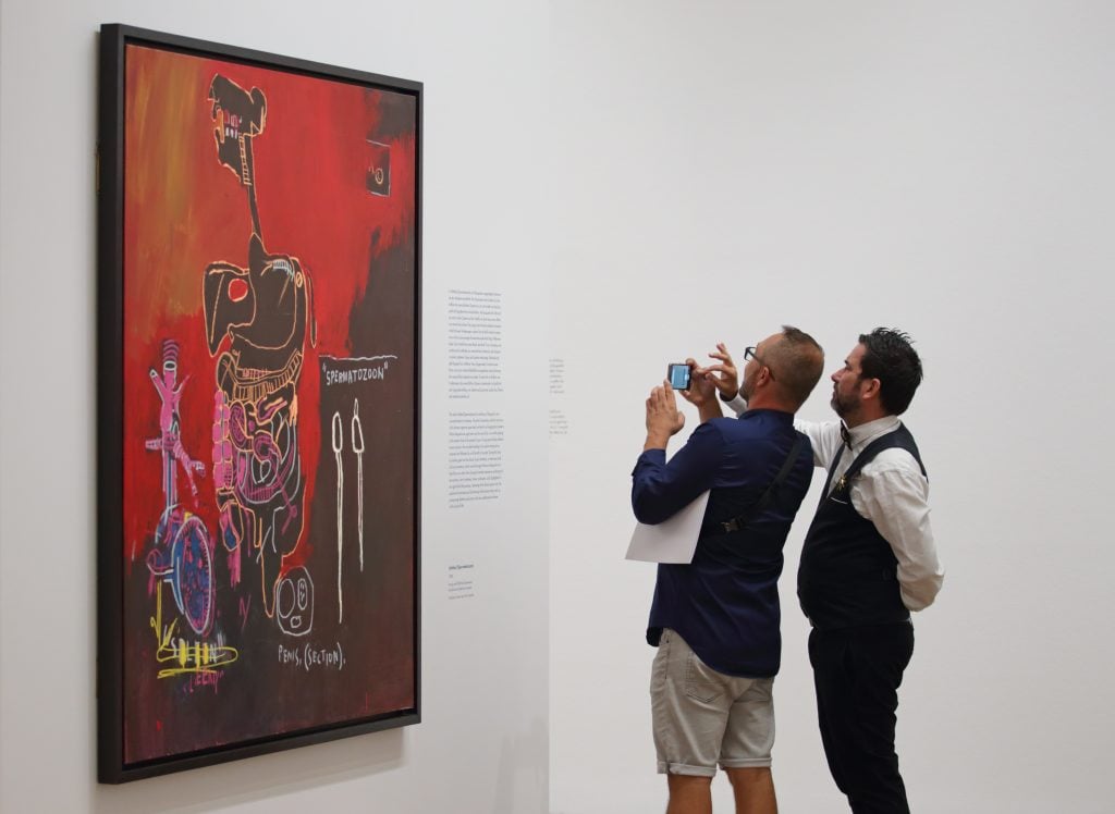 VIENNA, AUSTRIA - SEPTEMBER 08: Visitors attend the "Basquiat. Die Retrospektive" exhibition preview at Albertina on September 8, 2022 in Vienna, Austria. (Photo by Heinz-Peter Bader/Getty Images)