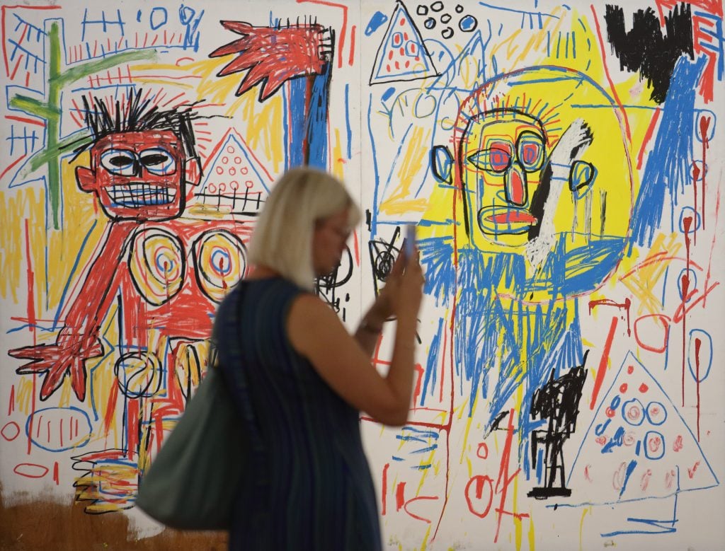VIENNA, AUSTRIA - SEPTEMBER 08: A visitor attends the "Basquiat. Die Retrospektive" exhibition preview at Albertina on September 8, 2022 in Vienna, Austria. (Photo by Heinz-Peter Bader/Getty Images)