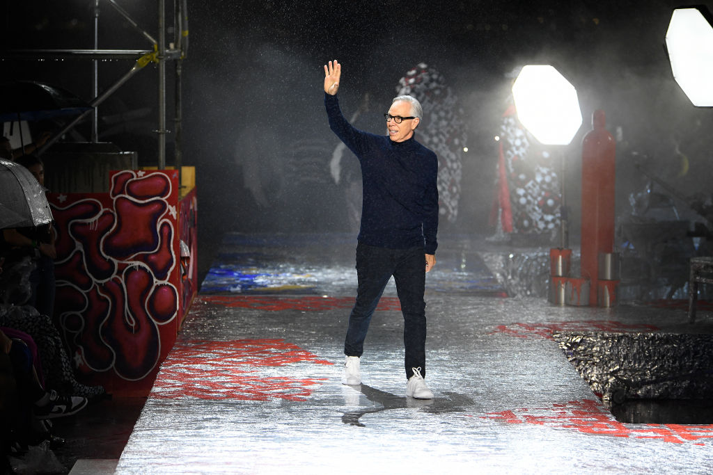 Designer Tommy Hilfiger on the tinfoil runway at his Andy Warhol-inspired Tommy Factory. Photo: Giovanni Giannoni / WWD via Getty Images.