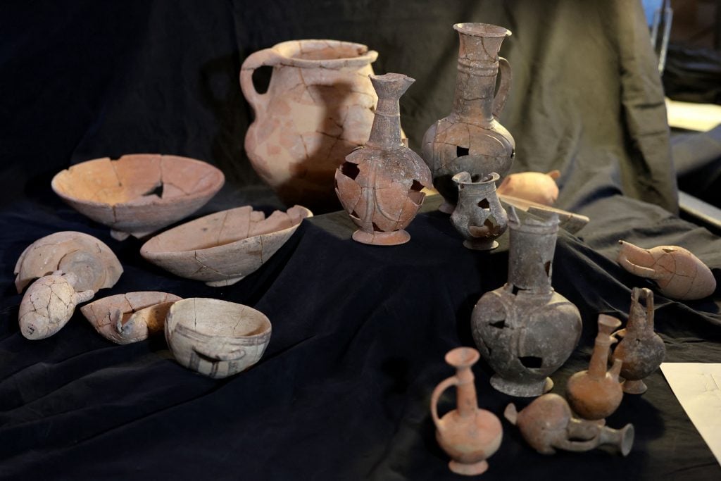 Vessels that are believed to have contained opium some 3,300 years ago, found at the Tel Yehud burial site. Photo by Ahmad Gharabli/AFP via Getty Images.