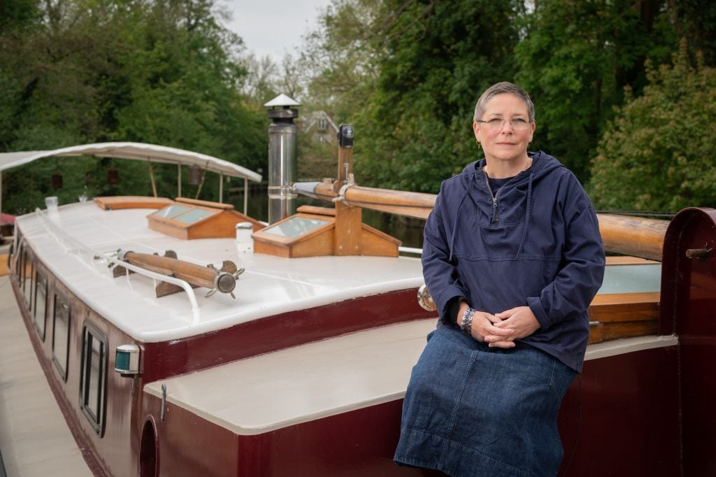 The artist Kate MccGwire atop her floating studio on London's River Thames. Courtesy of Royal Salute.