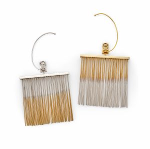 Venezulan artist Jesús Rafael Soto designed these silver <i>Penetrable</i> earrings (1968) with silver-gilt moving rods, just as he was creating his large-scale pieces of the same name. Courtesy of Sotheby's.