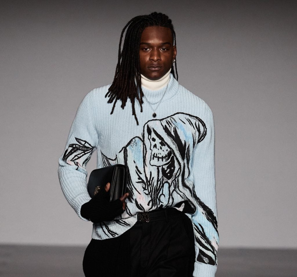 A sweater in the fall 2022 Amiri show is embroidered with Wes Lang's grim reaper motif. Courtesy of Amiri.