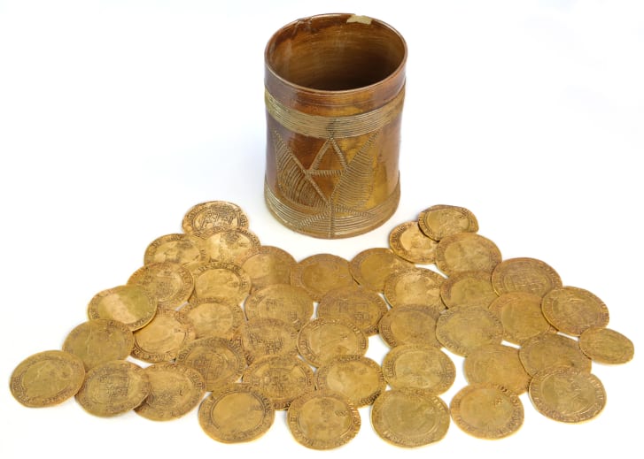 A British couple discovered this hoard of golden coins buried under their kitchen floor. Photo courtesy of Spink and Sons, London. 