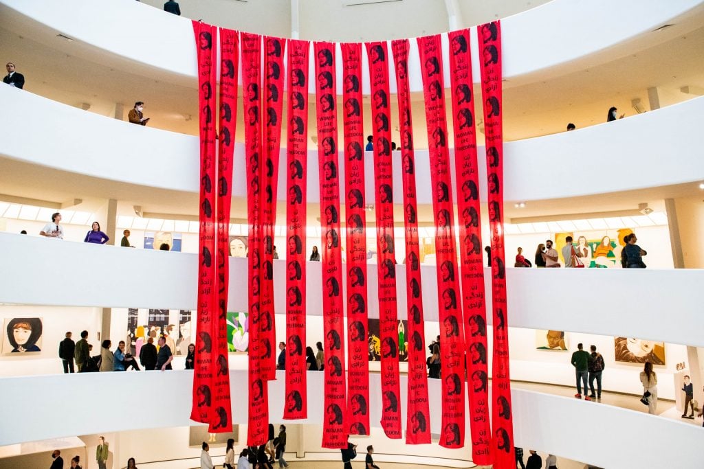 The Anonymous Artist Collective for Iran unfurled banners in the rotunda at New York's Solomon R. Guggenheim Museum in support of the women-led protests in Iran. Photo courtesy of the Anonymous Artist Collective for Iran.