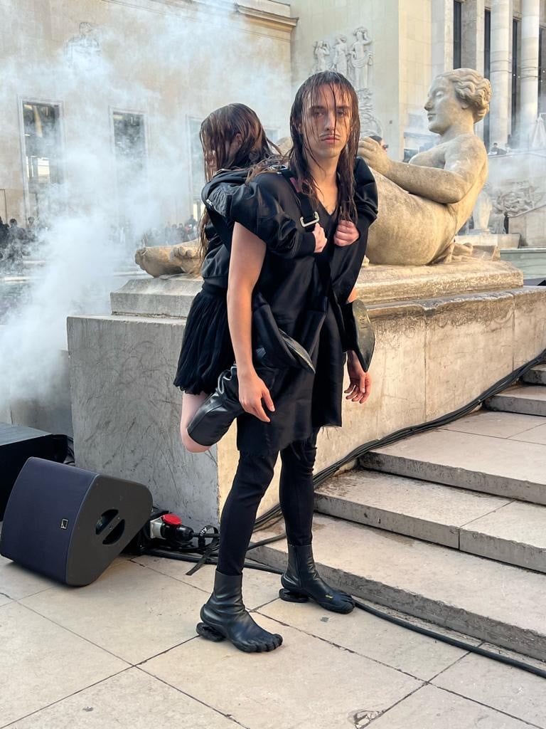 Tommy Cash sports a human backpack at the Rick Owens show during Paris Men’s Fashion Week, September 2022. Courtesy of Yulia Shadrinski.
