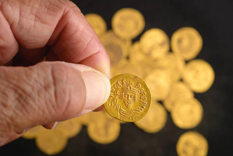 A coin featuring the image of eastern Roman emperor Phocas. Archaeologists in Israel say 44 pure gold coins dating to the 7th century have been found hidden in a wall at a nature reserve. All photos: Israel Antiquities Authority