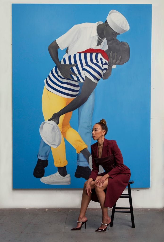 Amy Sherald in the studio with For love,and for country (2022). Photo: Kelvin Bulluck. Courtesy of the artist and Hauser & Wirth.