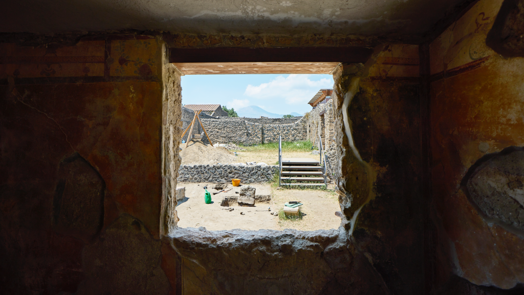 Mount Vesuvius is visible through a window on the site of this summer’s Tulane University Pompeii I.14 Project. Photo courtesy of Apple. 