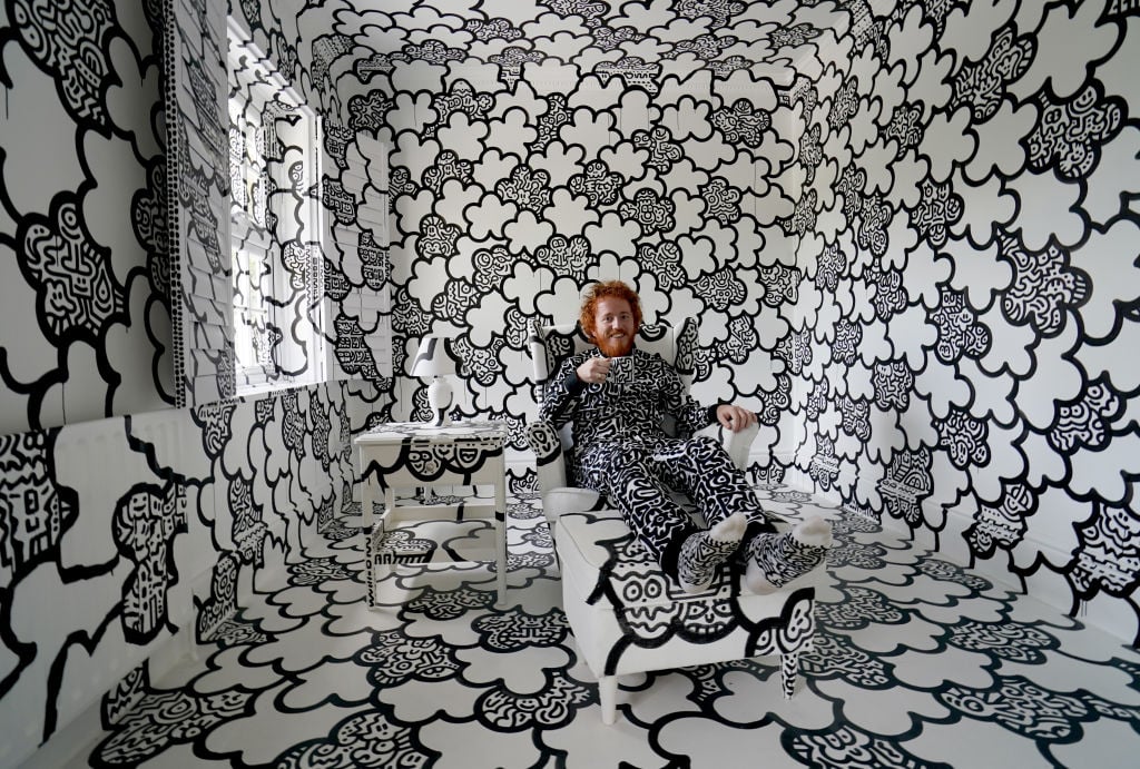 British artist Sam Cox, aka Mr Doodle, reveals the Doodle House, a twelve-room mansion at Tenterden, in Kent, which has been covered, inside and out in the artist's trademark monochrome, cartoonish hand-drawn doodles. Picture date: Monday October 3, 2022. (Photo by Gareth Fuller/PA Images via Getty Images)