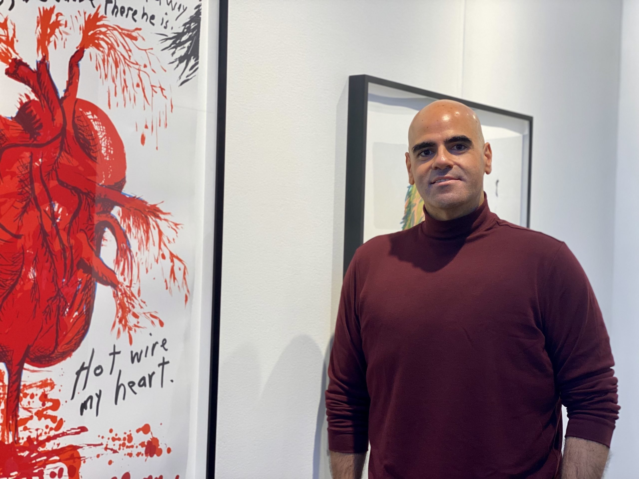 Ralph DeLuca with Raymond Pettibon prints at David Zwirner's IFPDA Fine Art Print Fair booth. Photo by Sarah Cascone.