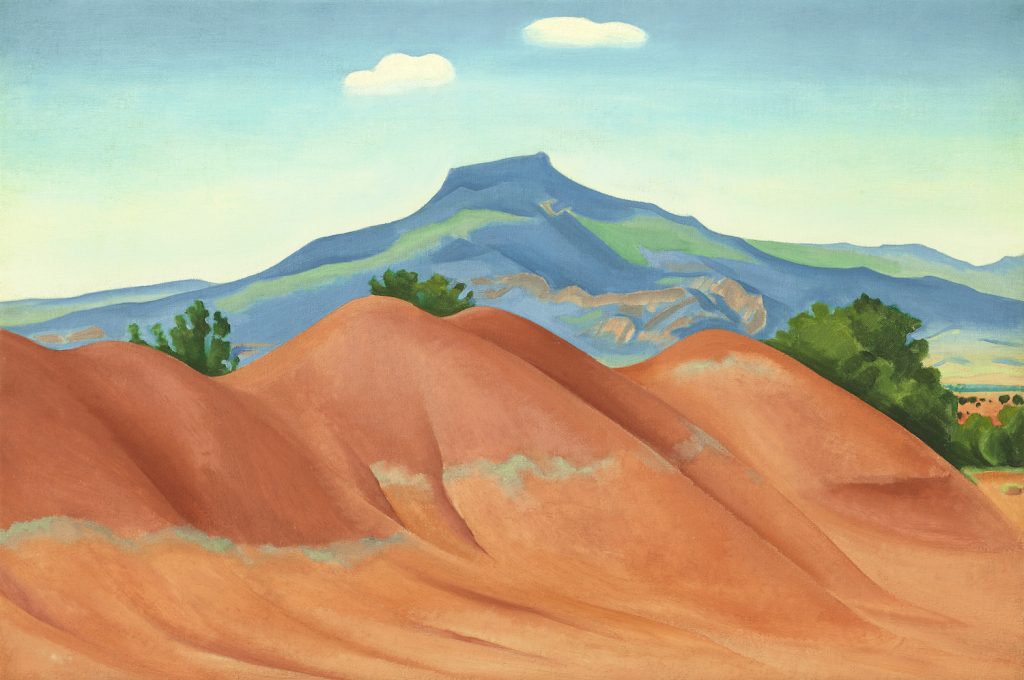 Georgia O'Keeffe, Red Hills with Pedernal, White Clouds (1936). Image courtesy Christie's.