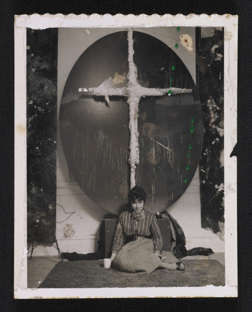 Jay DeFeo in front of an artwork, 1958 September. Jay DeFeo papers, ©Archives of American Art, Smithsonian Institution