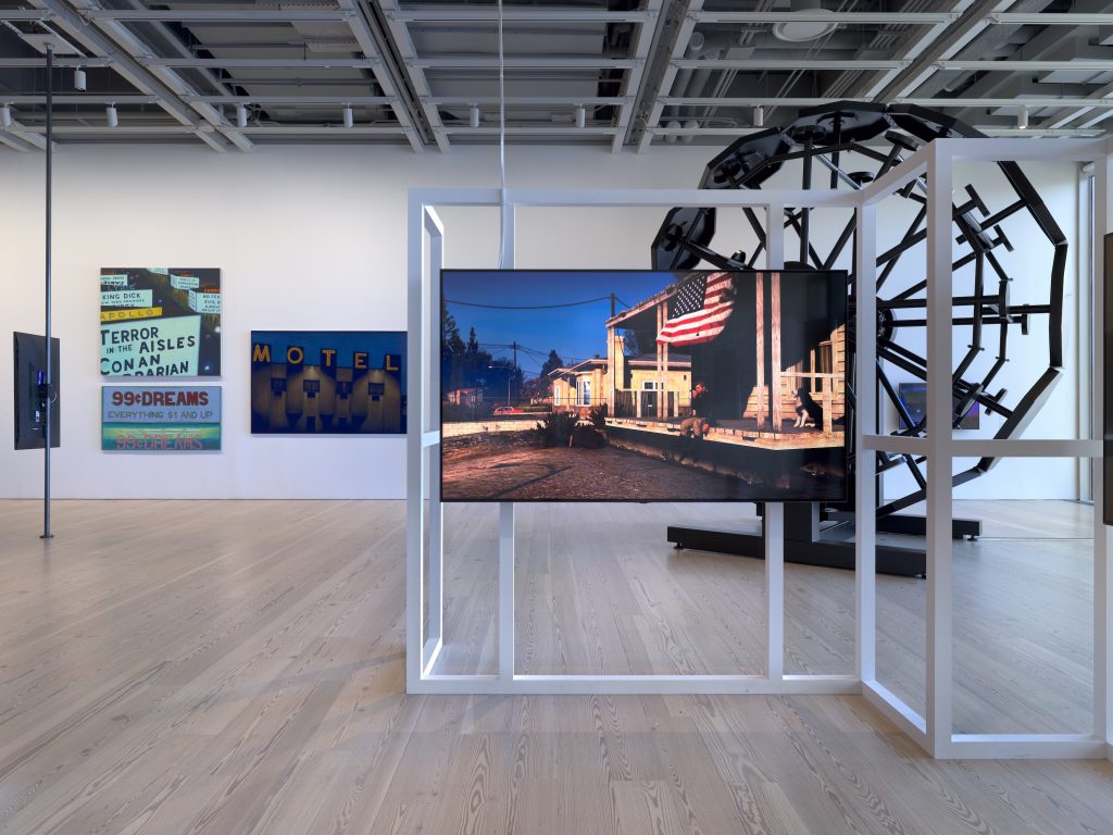 Installation view of "Whitney Biennial 2022: Quiet as It's Kept," including a detail of Jacky Connolly's <i>Descent Into Hell</i> (2022) in the foreground and works by Jane Dickson (left) and Sable Elyse Smith (right) visible in the background. Photograph by Ron Amstutz.
