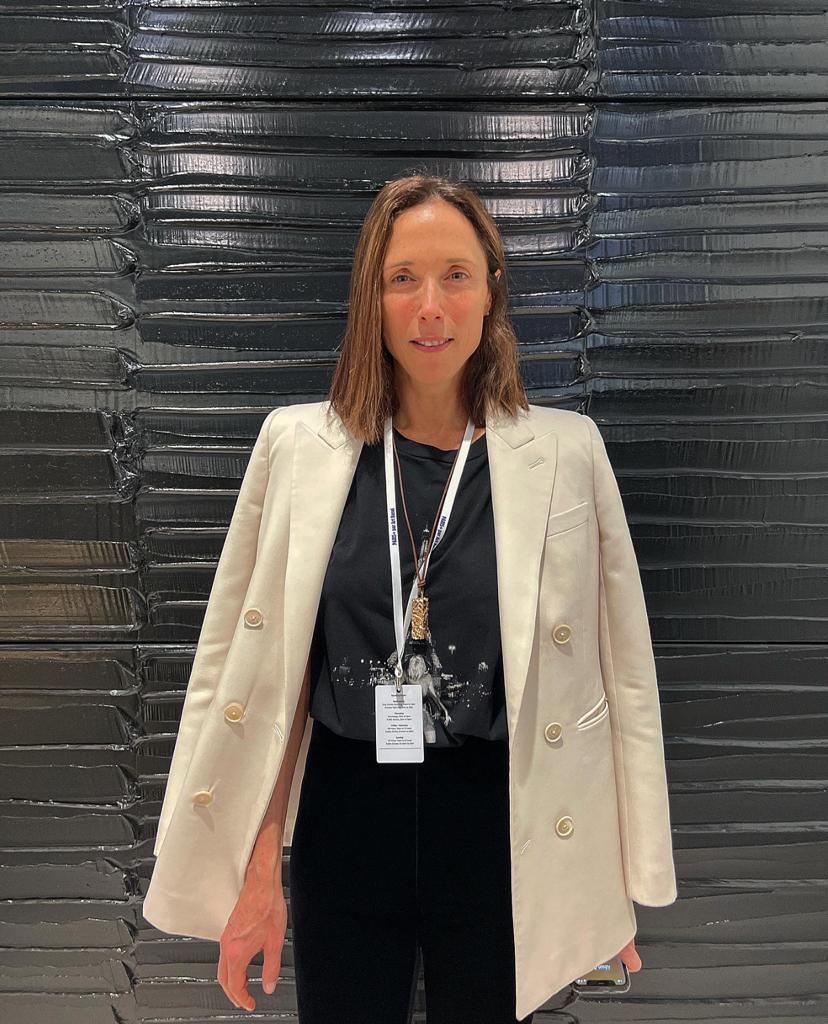 Amalia Dayan, one of the four brilliant partners of LGDR (Lévy, Gorvy, Dayan, Greenberg-Rohatyn)in front of a work by Pierre Soulages at ArtBasel Paris
