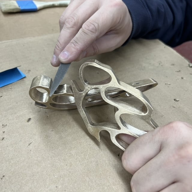 Robert Lazzarini in the studio creating one of the "brass knuckles" sculptures. Courtesy of the artist.