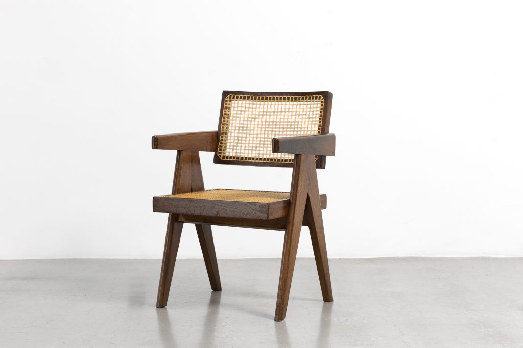 A wood-and-wicker "Office" chair (ca. 1955–1956) by Pierre Jeanneret. © Galerie Patrick Seguin.