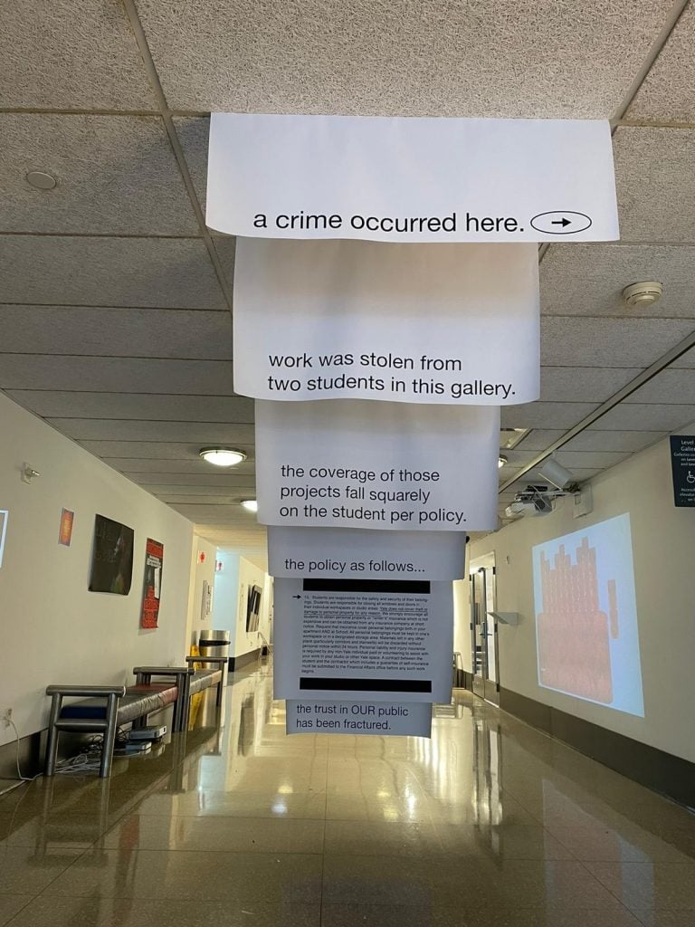Yale School of Art MFA student David Jon Walker installed these signs in the school after thieves stole two student works from an exhibition. Photo by Y. Malik Jalal.