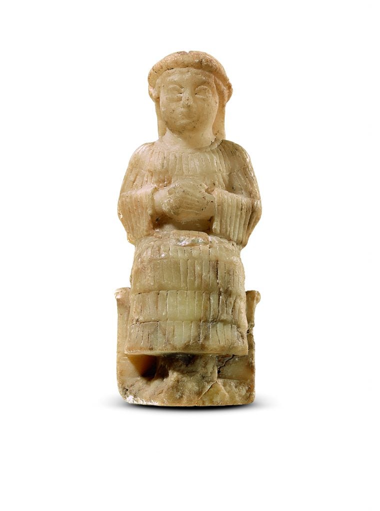 Seated female figure with tablet on lap Mesopotamia, Neo-Sumerian Ur III period (ca. 2,112–2,004 B.C.E.). Photo by Olaf M. Teßmer, ©Staatliche Museen zu Berlin-Vorderasiatisches Museum.