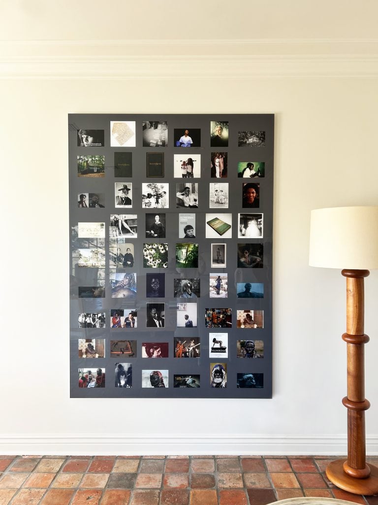 Arthur Jafa, from the 2018 “HA Crow” series, which features prints of various pictures arranged in grids including stock photography, fashion photography, colonialist photography, documentary photography, Instagram photography; selfies, film stills, advertisements, and posters. The lamp is by Charles Dudouyt. Photo courtesy of Sarah Harrelson.