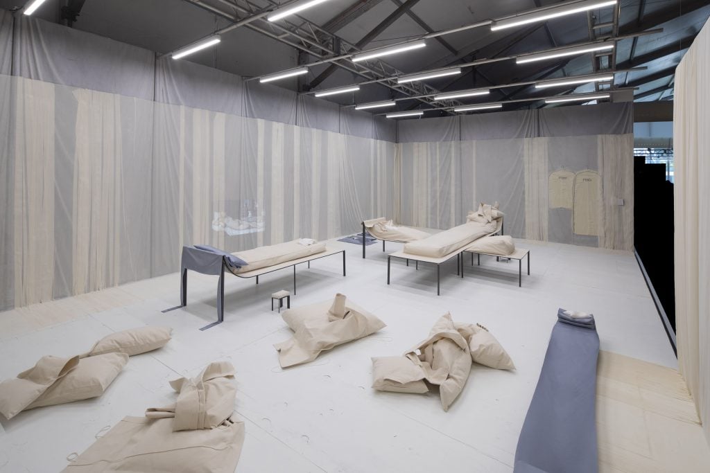 Lukas Gschwandtner's "Pillow Portrait" sculptures surround his furniture in Fendi presents Triclinium at Design Miami. Photo: Robin Hill. 