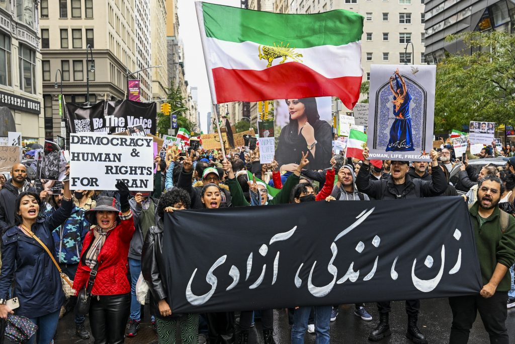 Protesters gather in Manhattan to show their opposition to the Iranian regime following the death of Mahsa Amini, a 22-year-old Iranian woman who died in police custody in Iran after allegedly violating the country's hijab rules. Photo by Alexi Rosenfeld/Getty Images.