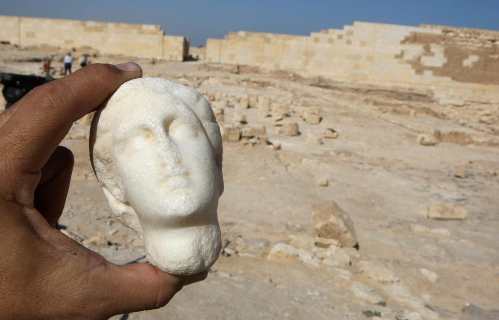 An alabaster statue of Cleopatra is shown to the press at the temple of Tasposiris Magna on the outskirts of Alexandria, on April 19, 2009. Archaeologists are now more convinced than ever that the tomb of Marc Anthony and Cleopatra lies nearby. Photo credit should read Cris Bouroncle/AFP via Getty Images.
