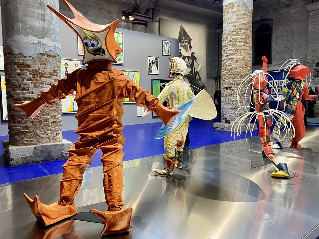 Lavinia Schulz and Walter Holdt, <em>Maskenfiguren (Mask figures)</em>, 1924 at "Biennale Arte 2022: The Milk of Dreams" in “Time capsule V: Seduction of the Cyborg” at the Arsenale, Venice Biennale. Photo by Sarah Cascone. 