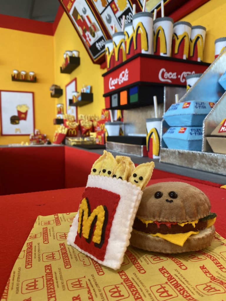 Details from Lucy Sparrow's Mcdonald’s installation at Scope Miami Beach. Photo by Sarah Cascone. 