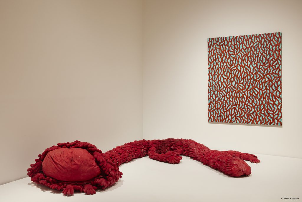 Installation view of <i>Red Flower </i>(1980) and <i>Gentle Are the Stairs to Heaven</i> (1990) at 'Yayoi Kusama: 1945 to Now,' 2022. Photo: Lok Cheng. M+, Hong Kong.
