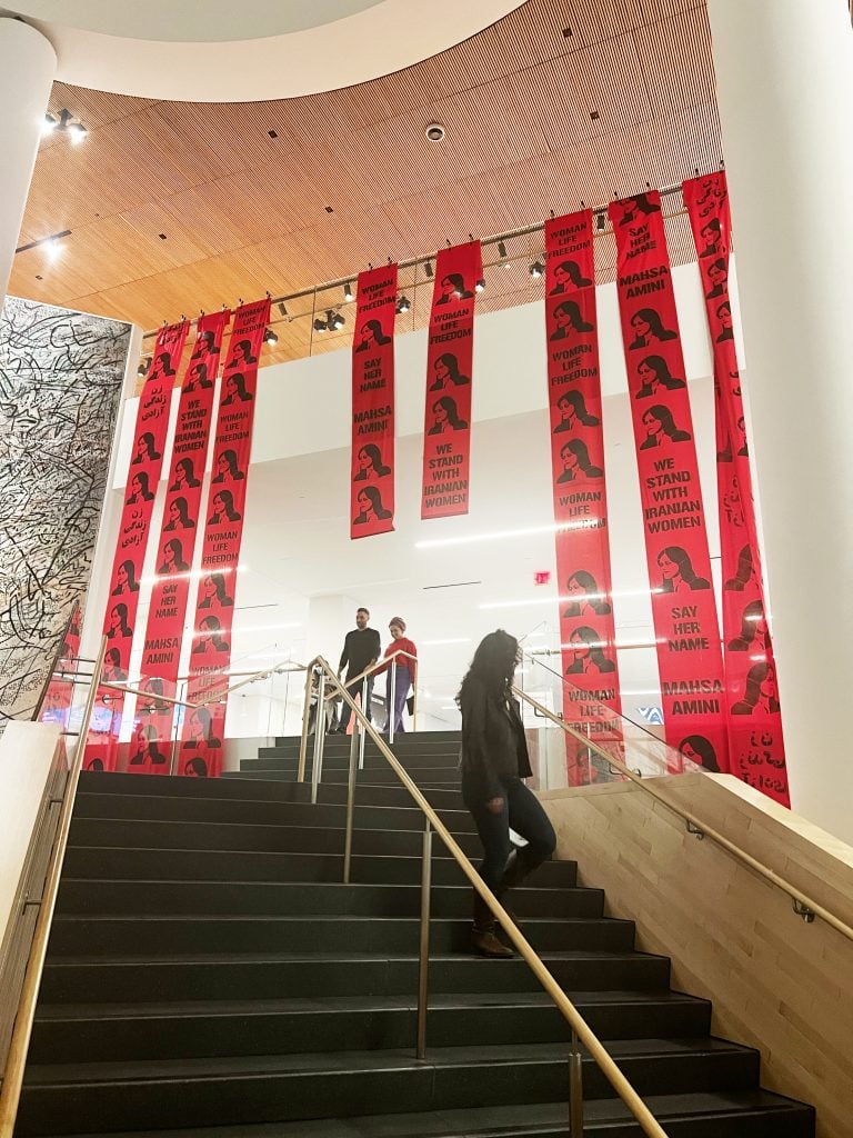 Mahsa Amini banners unfurled at the San Francisco Museum of Modern Art, in support of the Iranian protest movement. Photo courtesy of the anonymous artist protestors. 