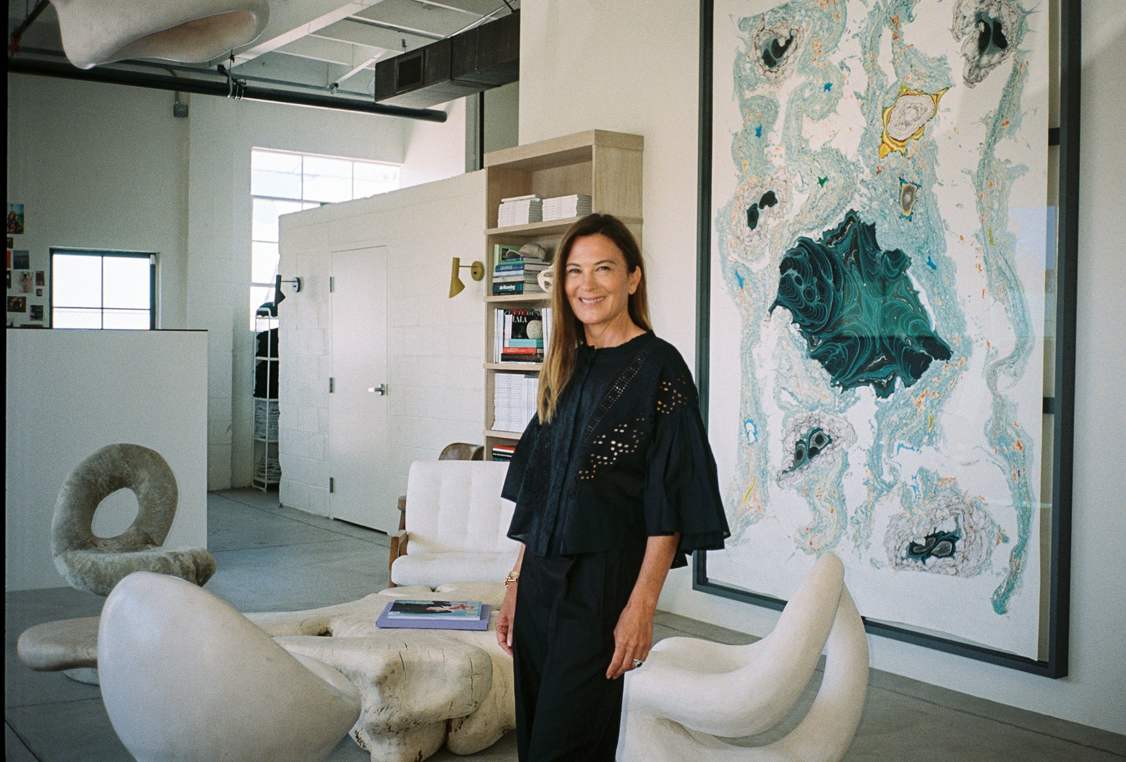 Sarah Harrelson in front of Kerstin Brätsch's painting unstable Talismanic Rendering (with gratitude to master marbler Dirk Lange), 2014. Photo by Emma Pickett.