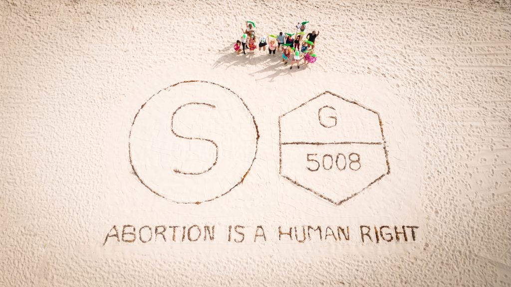 Michele Pred's activist art activation <em>Abortion Is a Human Right</eM> outside Untitled Art Miami. Photo by Misha Guseynov, Quality Media Photography and Videography.