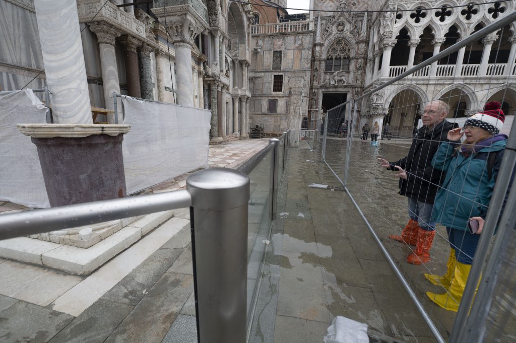 St. Mark's Basilica is now protected by transparent glass barriers that keep out the floodwaters of Acqua Alta events, as seen in this photo from December 10, 2022. The high tide was too low to operate the MOSE Experimental Electromechanical Module that protects the city of Venice from floods. Photo by Andrea Pattaro for AFP via Getty Images. 