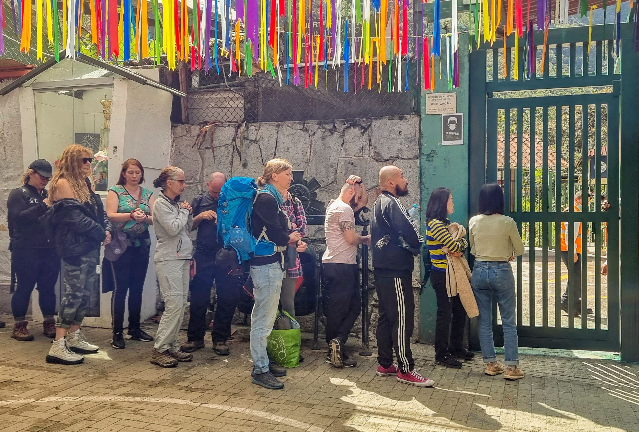 Stranded tourists queue at the train terminal in the town of Machu Picchu, Perus main tourist attraction, on December 14, 2022, after the suspension of train services to and from Machu Picchu due to protests against the new president Dina Boluarte after the dismissal of Pedro Castillo. Photo by Jesus Tapia/AFP via Getty Images.