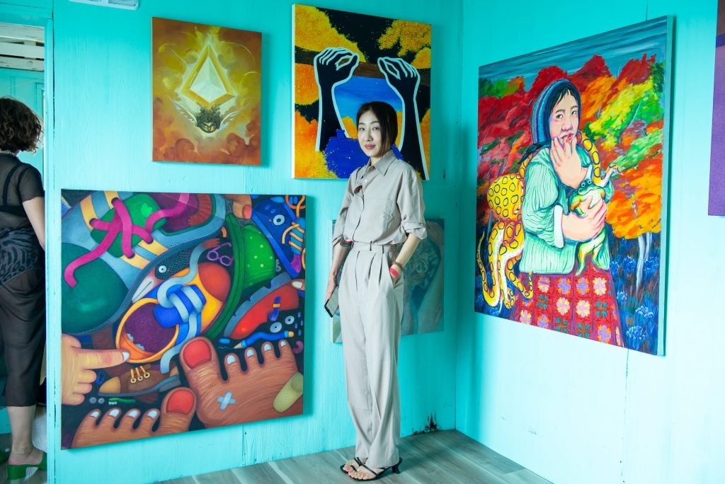 Artist Young Lee with her work at Half Gallery's Stiltsville show. Photo by Justin Namon.