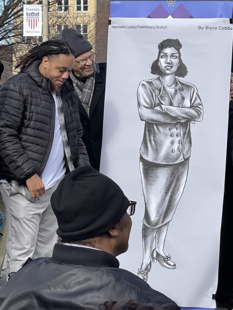 Artist Bryce Cobbs with the drawing he created of Henrietta Locks that will be used for the bronze sculpture. Photo by Cheryl Mosley. Image courtesy the artist.