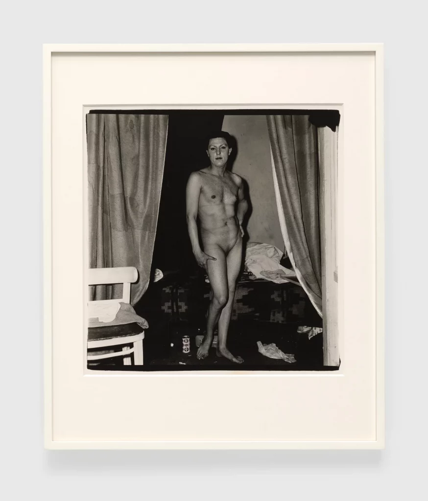 Diane Arbus, <i>A naked man being a woman, N.Y.C.</i> (1968). Photo ©the Estate of Diane Arbus.