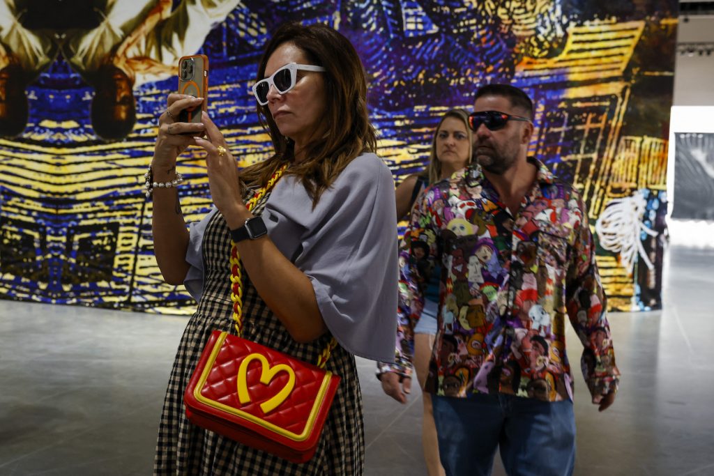 People look at artwork during the Miami Art Basel 2022