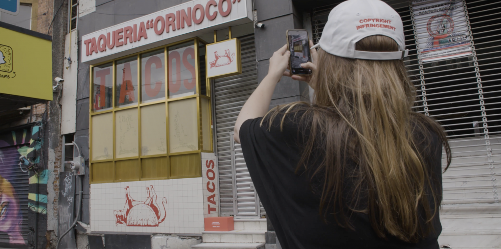 Cj Hendry in Copyright Infringement posting the location of a box to her IG story in Mexico City, Mexico. Photo courtesy of D’Marie Productions.
