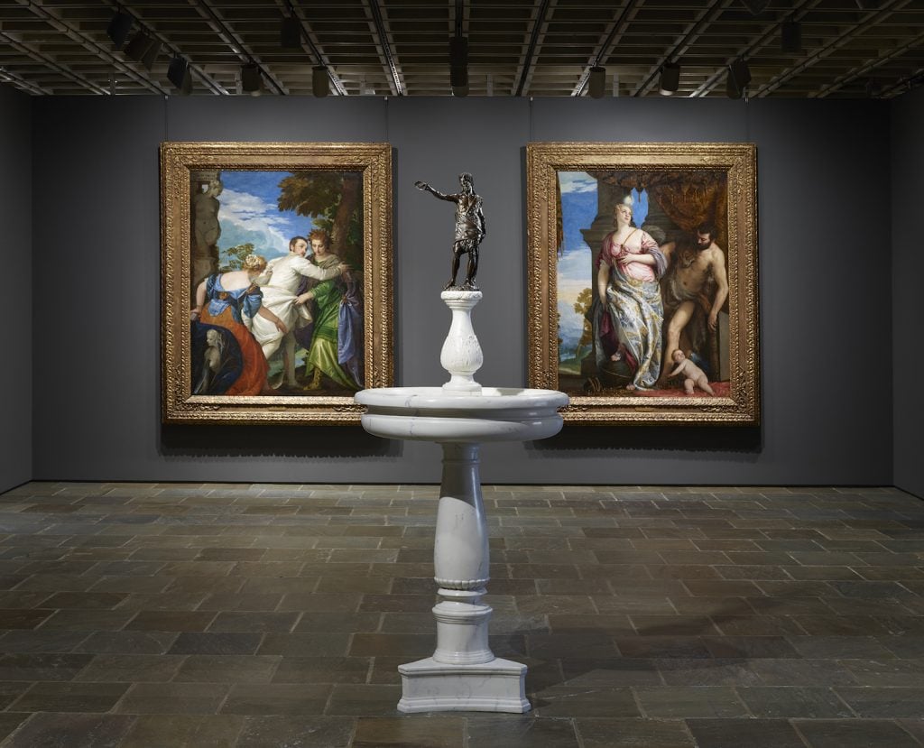 Installation view of third floor central Italian gallery and Francesco da Sangallo's St. John Baptizing atop a replica of its original base, the marble holy water font in the town of Prato, in Tuscany. Photo by Joseph Coscia Jr.. Image courtesy The Frick.